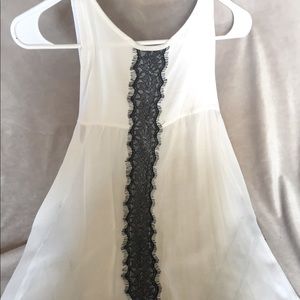 Sheer tank with lace details.